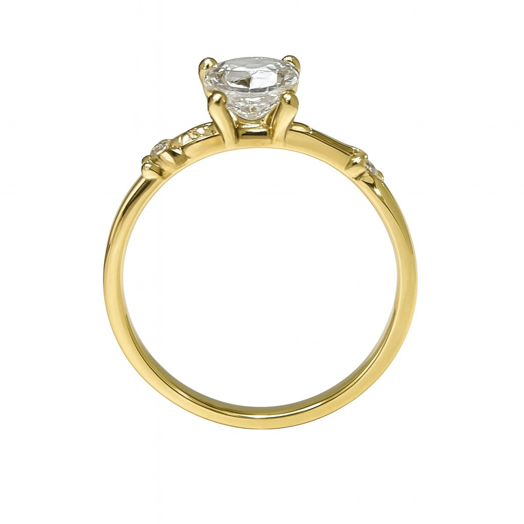 טבעת זהב צהוב 14K עם יהלום עגול וסגנון קוצים מראה קלאסי עם טוויסט מודרני